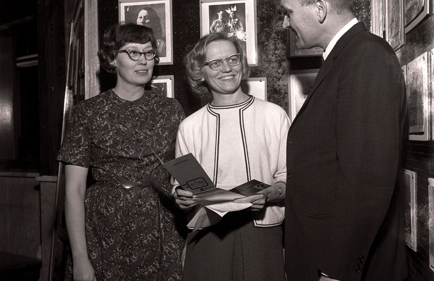 Dorothy Neuhaus looking at Director James Howard 