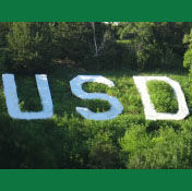 Hillside concrete letters U, S, and D